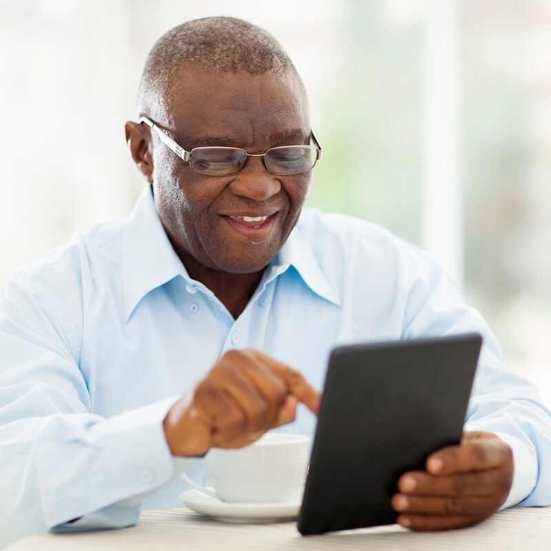 African American man using an iPad